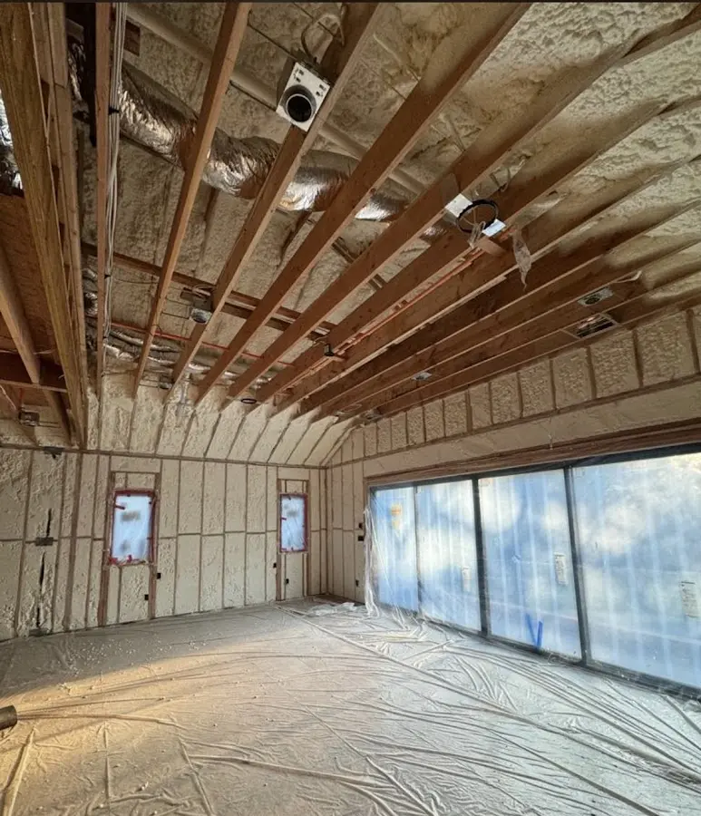 Interior walls and ceiling insulated with spray foam during new construction in Farmington